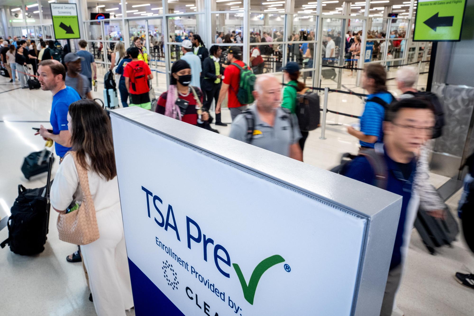 A TSA Pre-check sign is visible as travelers move through Hartsfield-Jackson Atlanta International Airport on June 28, 2024 in Atlanta, Georgia. (Andrew Harnik/Getty Images North America/TSA)
