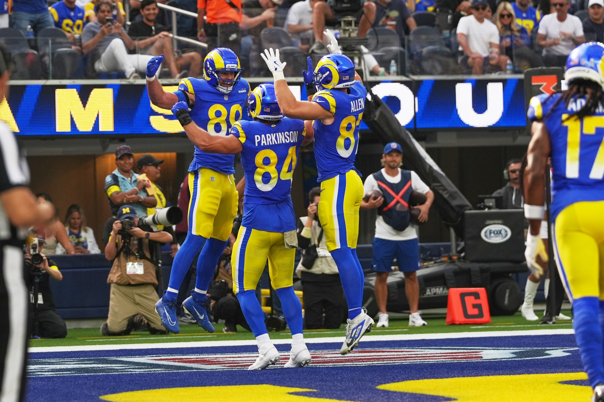 Rams tight ends, from left, Tyler Higbee, Colby Parkinson and Davis Allen celebrate Higbee’s touchdown in the first half against the New Orleans Saints on Nov. 2, 2025, at SoFi Stadium. (AP Photo/Gregory Bull)
