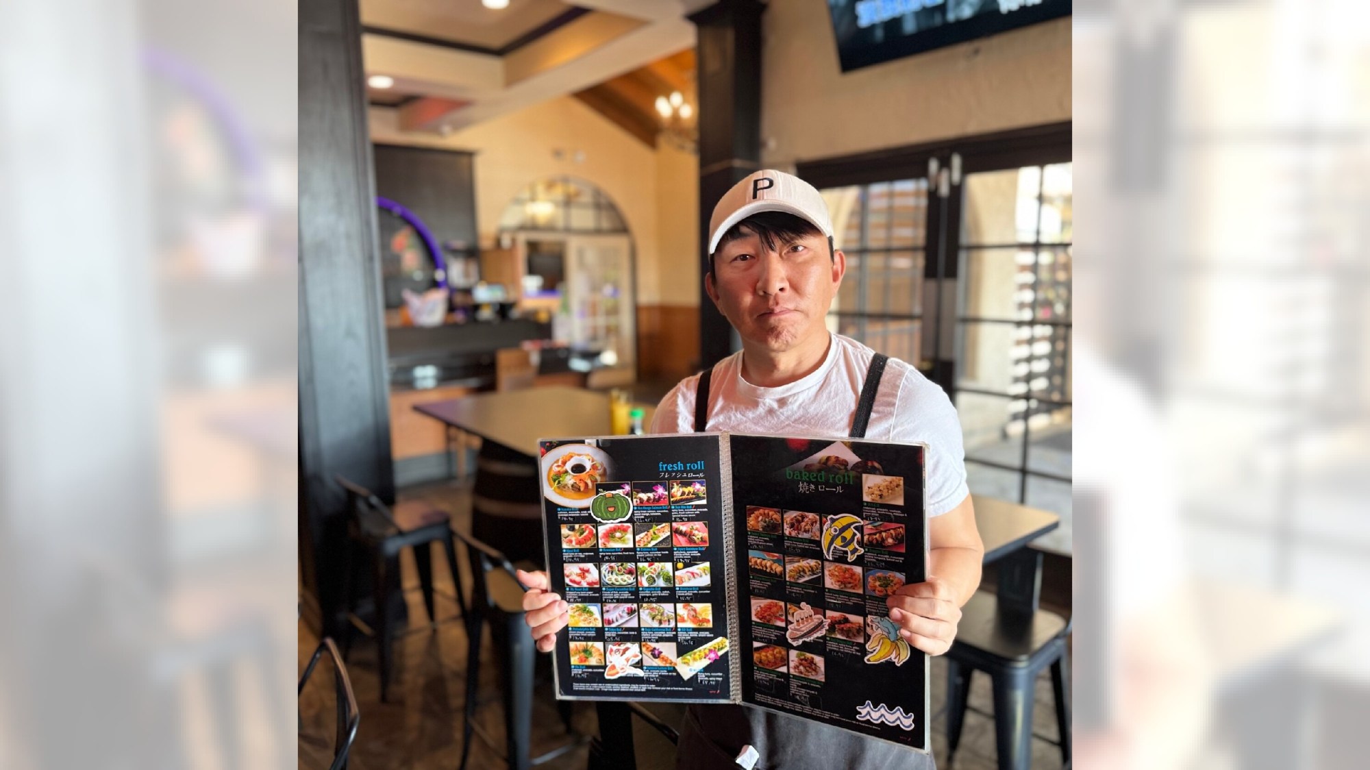 Simon Yoon ran a popular take out sushi-styled restaurant tucked away in a strip center in Diamond Bar where commuters often stopped to pick up a bite to eat and wait out the rush hour congestion at the 57 and 60 freeway interchange. But last month, Yoon shuttered his restaurant, Fusion 2 Any 1, because he could no longer make ends meet due to a wave of policy decisions to remake the economy by U.S. President Donald Trump, just under a year in office now. Above, on Nov. 4, 2025, Yoon shows off a menu from a downsized restaurant that he plans to open. (Photo by Pat Maio)
