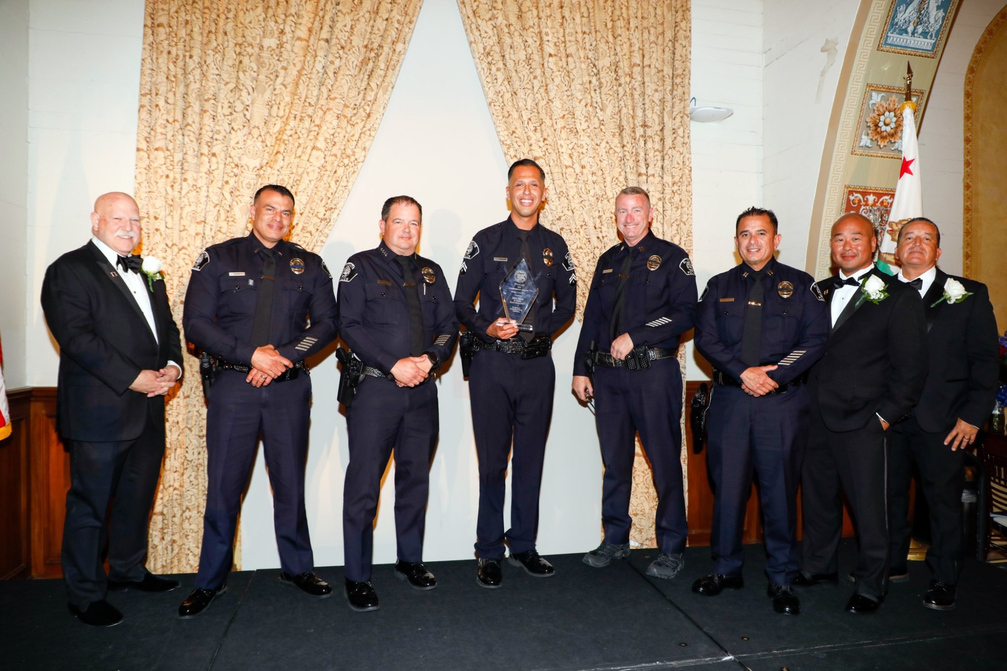 The Peace Officers Association of Los Angeles County honored Cpl. Jesus Rojas of the El Monte Police Department with its Centurion Award for Excellence in Community Policing in Los Angeles on Oct. 27. From left, John Incontro, association president and San Marino police chief; Lt. Douglas Knight; Chief Jake Fisher of El Monte Police Deaprtment; Rojas; Capt. Michael Buckhannon; Capt. Richard Luna of El Monte Police Department; Lt. Aram Choe; and David Reynoso, emeritus El Monte police chief. (Photo courtesy of POALAC)
