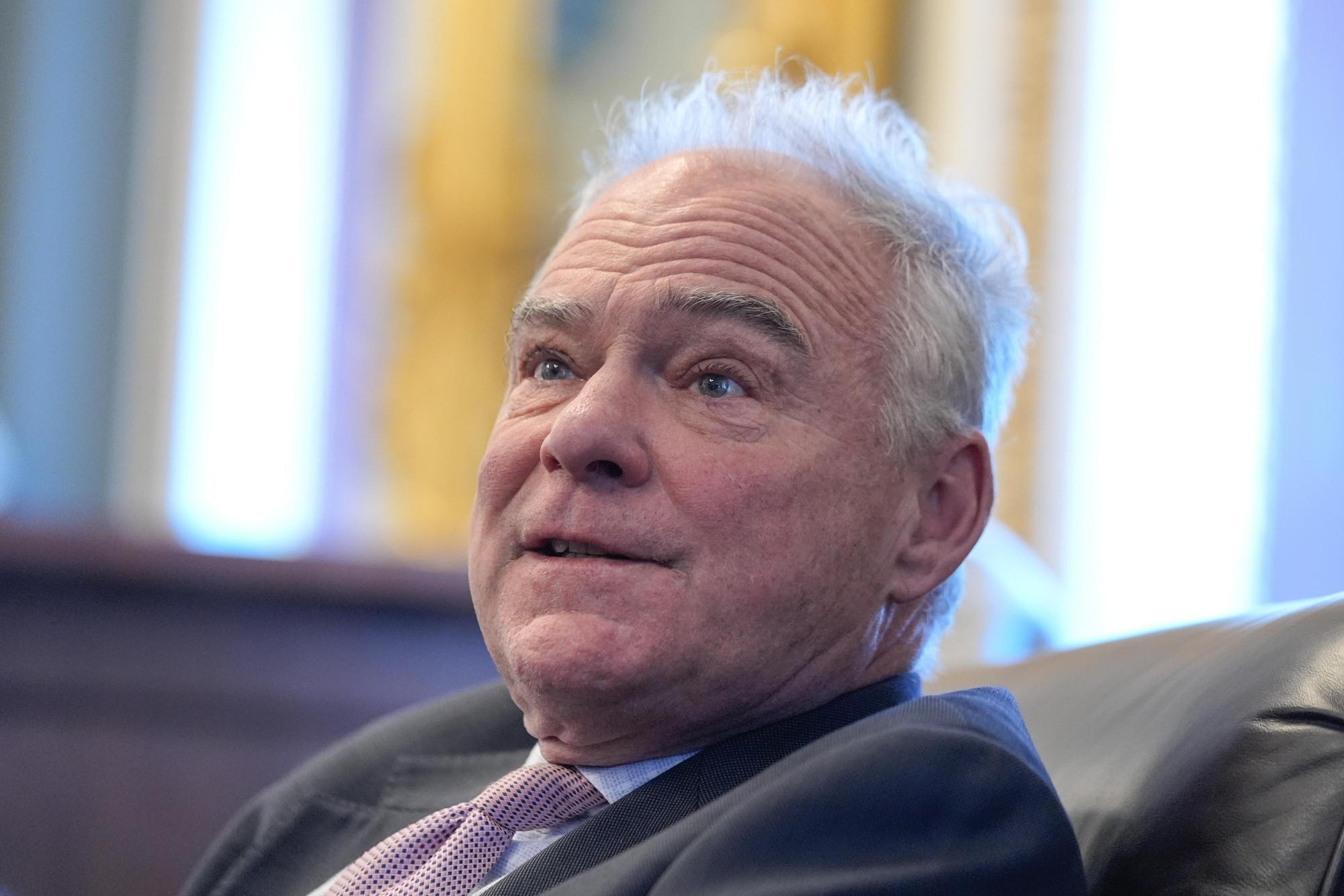 Sen. Tim Kaine, D-Va., speaks to reporters about a war powers resolution regarding Venezuela on Capitol Hill, Wednesday, Jan. 7, 2026, in Washington. (AP Photo/Mariam Zuhaib)
